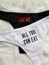 Load image into Gallery viewer, Eat me design red text on black thong, all you can eat design black text on white thong