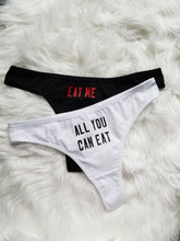 Load image into Gallery viewer, Eat me design red text on white thong, all you can eat design black text on white thong