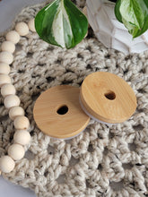 Load image into Gallery viewer, Two bamboo lids with straw holes for glass cans.