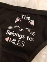 Load image into Gallery viewer, Black thong with "this kitty belongs to" design with heart, image of cat, and name underneath