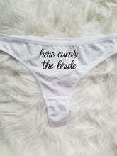 Load image into Gallery viewer, Women's white thong with "Here cums the bride" in black cursive text.