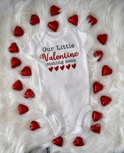 Load image into Gallery viewer, Baby bodysuit in white with &quot;Our Little Valentine Coming Soon&quot; text in black and red.
