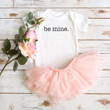 Load image into Gallery viewer, White baby bodysuit with text &quot;Be mine&quot; in black text. Bodysuit shown with pink fluffy tutu and pink flowers for decoration.
